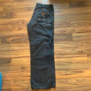Carhartt work pants in good used condition. No holes. Size 34 x 34 Loose fit.